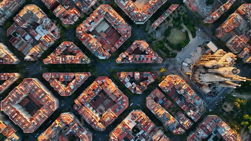 Preview: Aerial view of Barcelona Eixample residential district and Sagrada Familia Basilica at sunrise