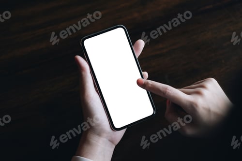 Preview: Close up Woman hand Using a Smart Phone with blank screen at coffee shop.