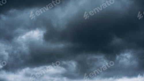 Preview: Overcast sky with dark clouds. Dark sky before a thunder-storm.