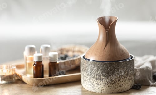 Visualização: Composição de spa com umidificador de ar e óleos aromáticos.