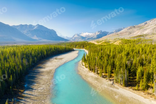 Preview: A drone view of the river in the mountains valley. An aerial view of an autumn forest.