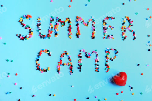 Preview: Flat lay composition with words SUMMER CAMP made from beads on color background