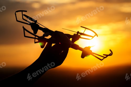 Preview: drone in the hand of a man in the sunlight