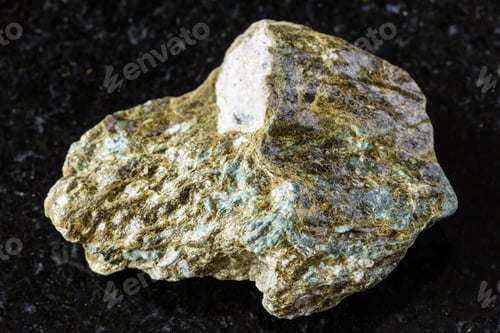 Preview: sample of raw lobanovite mineral on black granite