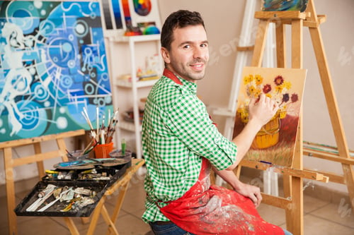 Preview: Handsome male artist at work