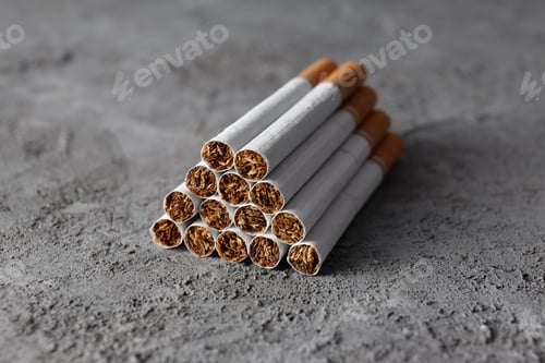 Preview: Concept of harm of smoking, cigarettes on gray textured background