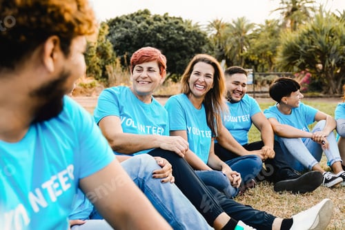 Preview: Volunteer: Multi ethnic people having fun together outside. International team group support