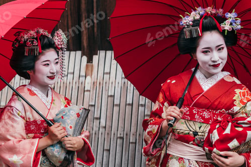 Preview: Maiko geishas walking on a street of Gion
