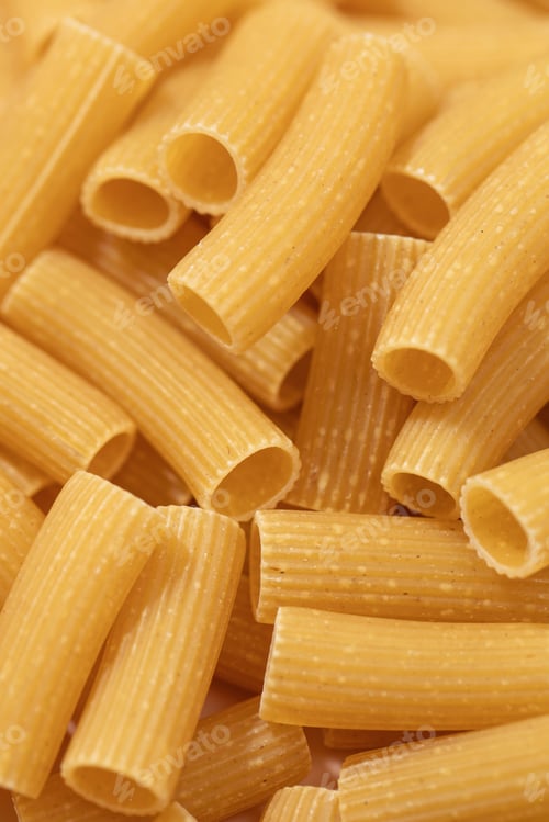 Preview: Closeup of uncooked rigatoni pasta, showcasing the texture and shape