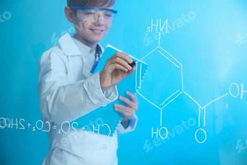 Preview: Schoolboy writing chemistry formula on glass board against color background. Space for text