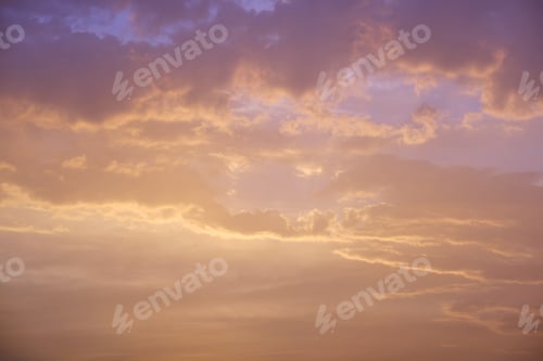 Preview: Dramatic bright red sky with orange-gray th.underclouds at sunset over a dark mountain
