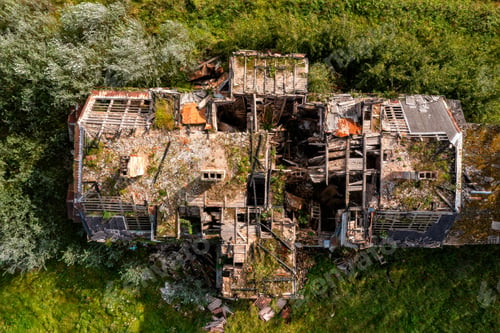 Preview: Ruins of a destroyed house in the village. View from above.