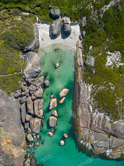 Preview: Scenic top view of the turquoise sea and jagged rock formations on the coast