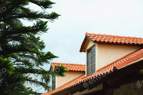 Preview: Ranch-style house features terracotta roof under a cloudy sky