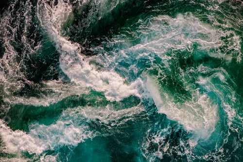 Preview: Blue waves of water of the river and the sea meet each other during high tide and low tide.