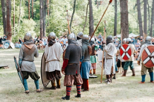 Preview: Vikings in chain mail armed with spears, shields and swords standing on the battlefield