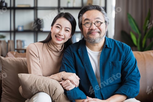 Preview: Asian Middle-aged Asian couple smiling at the camera. Family couple portrait