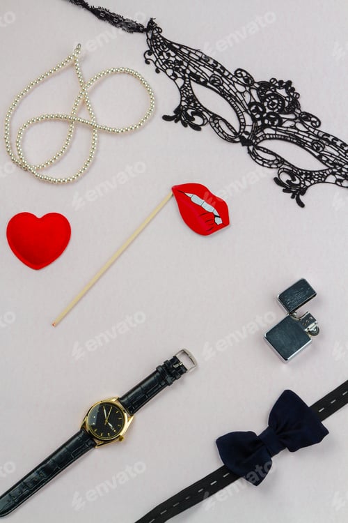 Preview: Vertical shot arrangement of male and female accessories.
