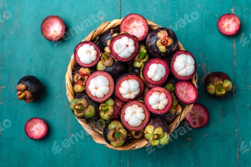 Preview: Mangosteen fruit on light blue wooden background,Tropical fruit