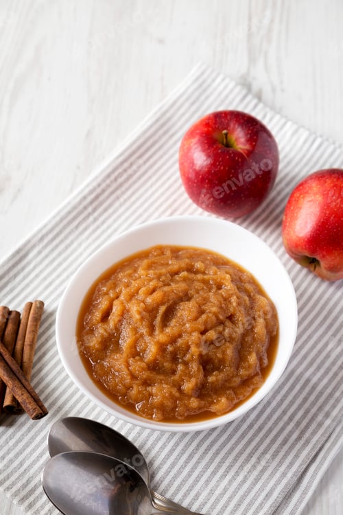 Preview: Homemade Raw Apple Sauce in a White Bowl, side view.