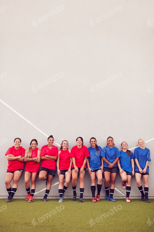 Preview: Graphic Shot Of Womens Football Team Leaning Against Wall Whilst Training For Soccer Match