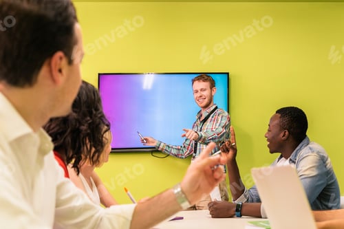 Preview: Teacher explaining the lesson to his students.
