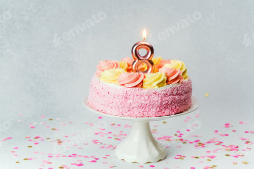 Preview: Celebrate a special day with a delightful pink birthday cake topped with candles