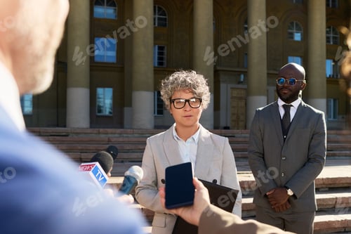 Preview: Middle Aged Caucasian Woman Speaking to Journalists during Outdoor Press Conference