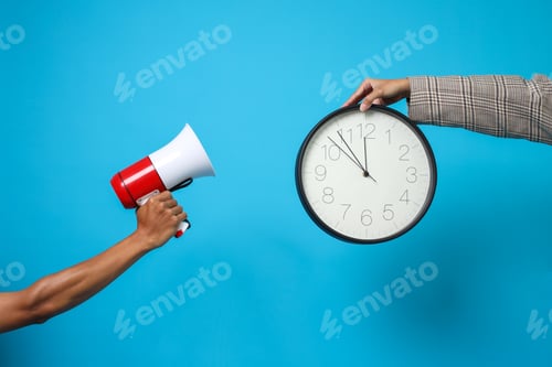 Preview: Hands Showing Megaphone And Holding Clock