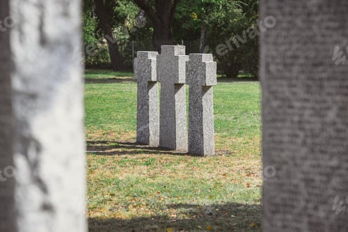 Preview: selective focus of identical gravestones placed in row at graveyard