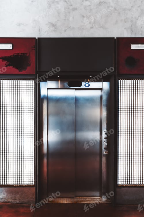 Preview: Old elevator indoors with digit 8 on the top
