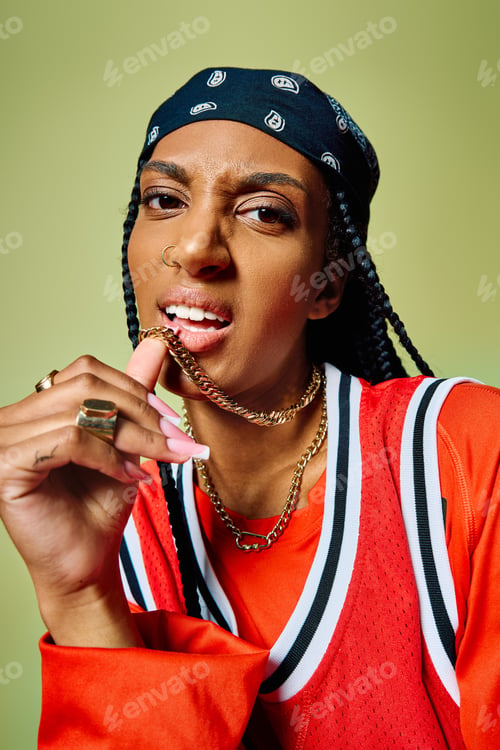 Preview: A young woman poses confidently, highlighting her unique style against a colorful backdrop.