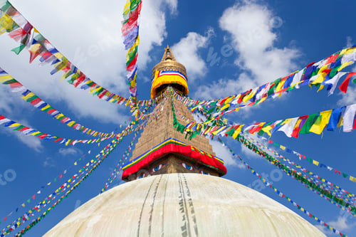Preview: Low angle view of colourful prayer flags on stupa of Buddhist temple.