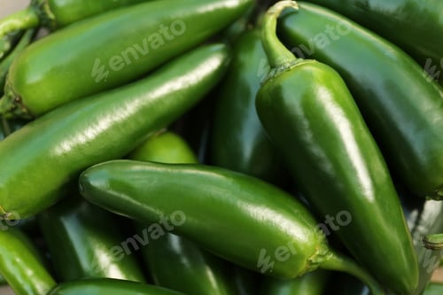 Preview: Green hot chili peppers as background, closeup