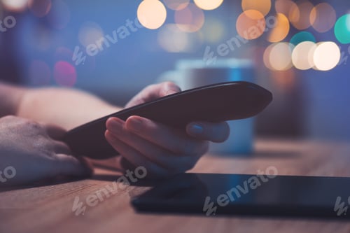 Preview: Female hand with television remote control