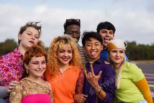 Preview: Group of diverse young people having fun together outdoor