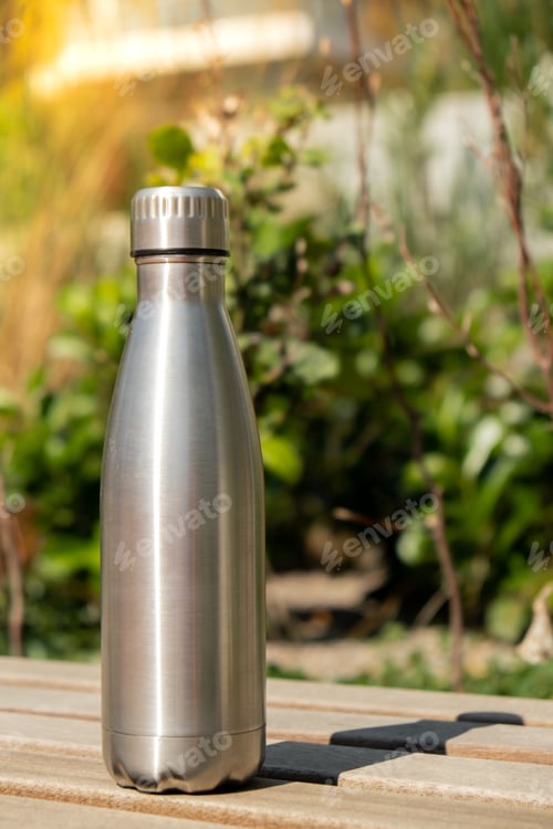 Preview: Water bottle. Reusable steel thermo water bottle on wooden bench. Sustainable lifestyle. Plastic
