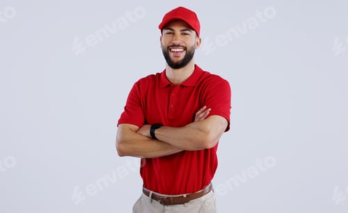 Preview: Happy man, portrait and professional delivery guy with arms crossed in confidence against a gray st