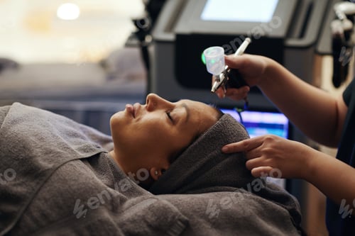 Preview: Cosmetologist Spraying Treatment