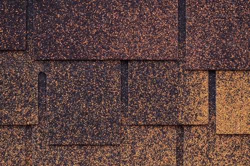 Dark brown and yellow surface of roofing tiles. Cover of shape of squares. Dark brown and yellow surface of roofing tiles. Cover of shape of squares.