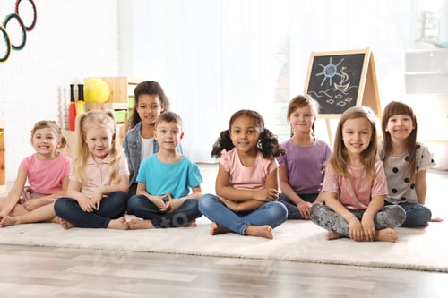 Preview: Group of cute little children sitting on floor indoors. Kindergarten playtime activities