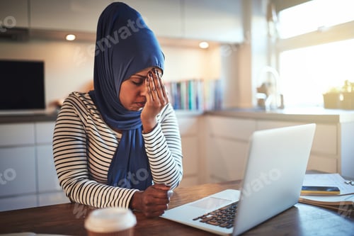 Preview: Stressed out young Arabic female entrepreneur working online from home