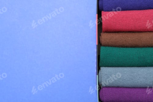 Preview: Box with socks on blue background, space for text