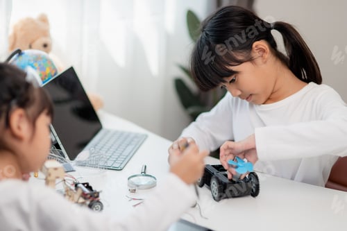 Preview: Asia students learn at home in coding robot cars and electronic board cables in STEM,