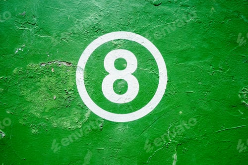 Preview: Painted white number 8 on a green textured wall