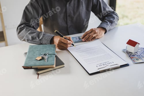 Preview: Businessman signing a legal real estate contract agreement, home Insurance, loan, mortgage, rent.
