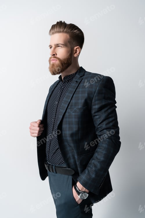 Preview: portrait of pensive elegant bearded man in suit isolated on white