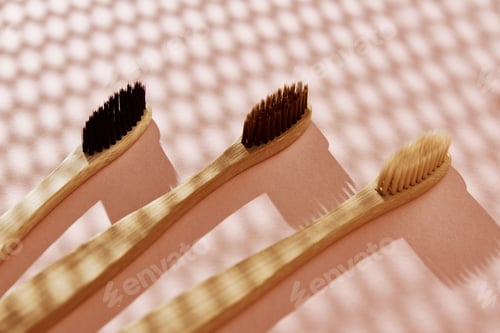 Preview: Reusable bamboo toothbrushes on pink background. Zero waste