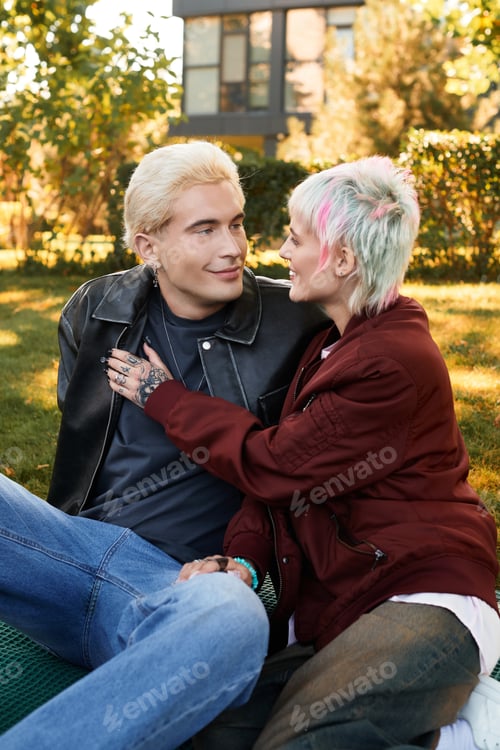 Preview: Young couple enjoys a blissful moment together in a sunny park setting