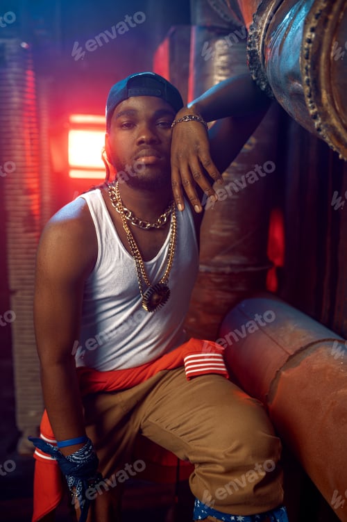 Preview: Stylish rapper in yellow hoodie and baseball cap